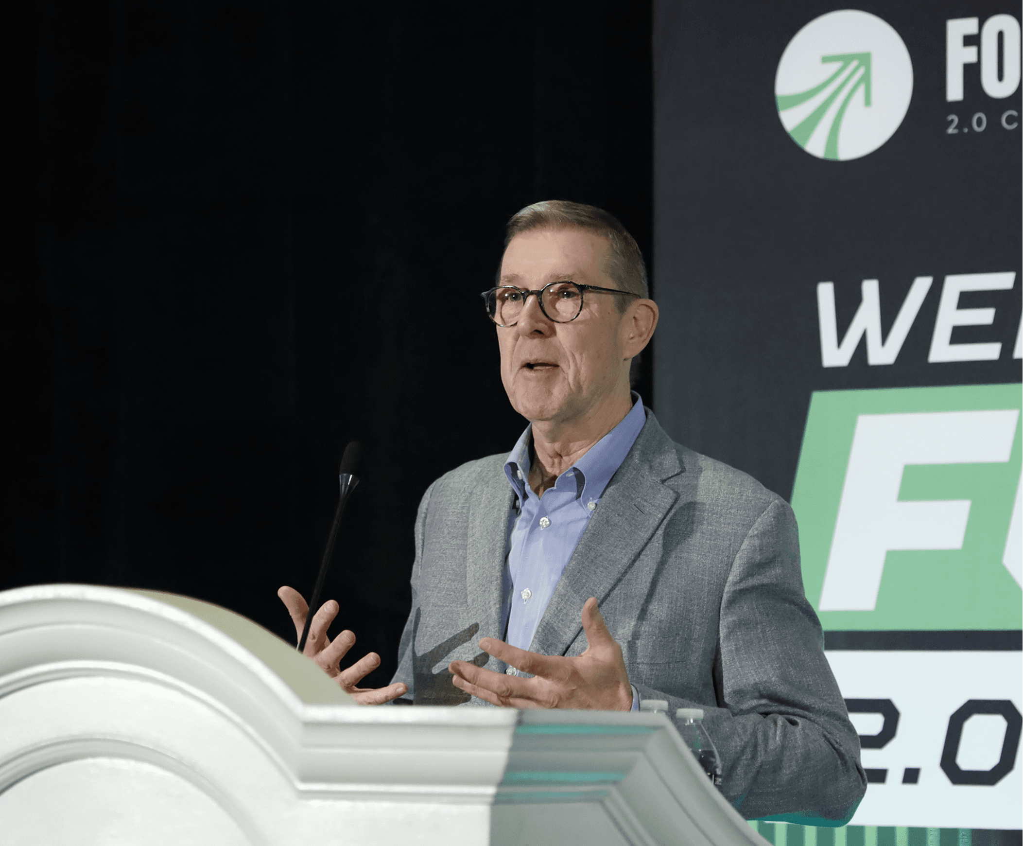 Conference speaker at podium